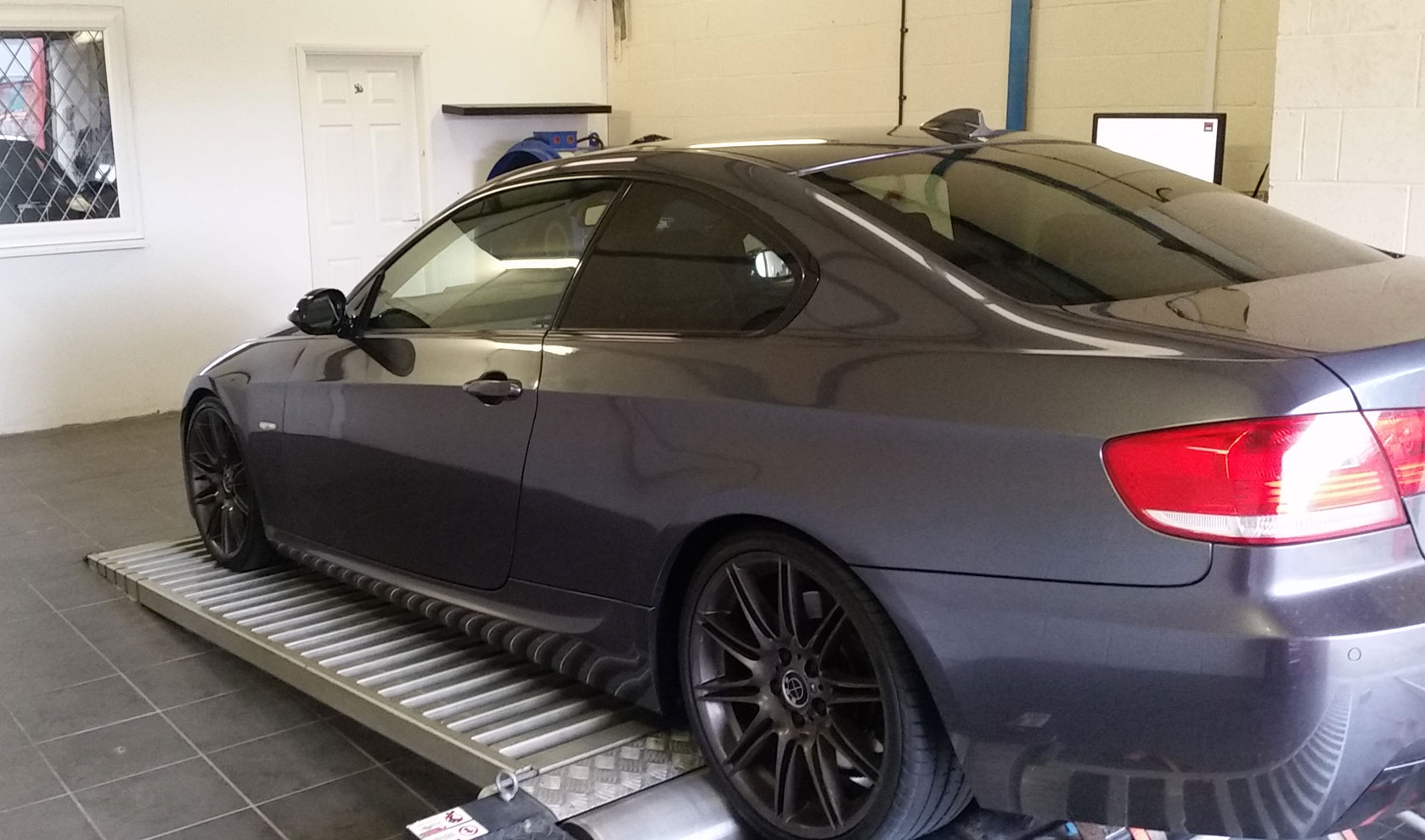 BMW positioned on a dyno for tuning